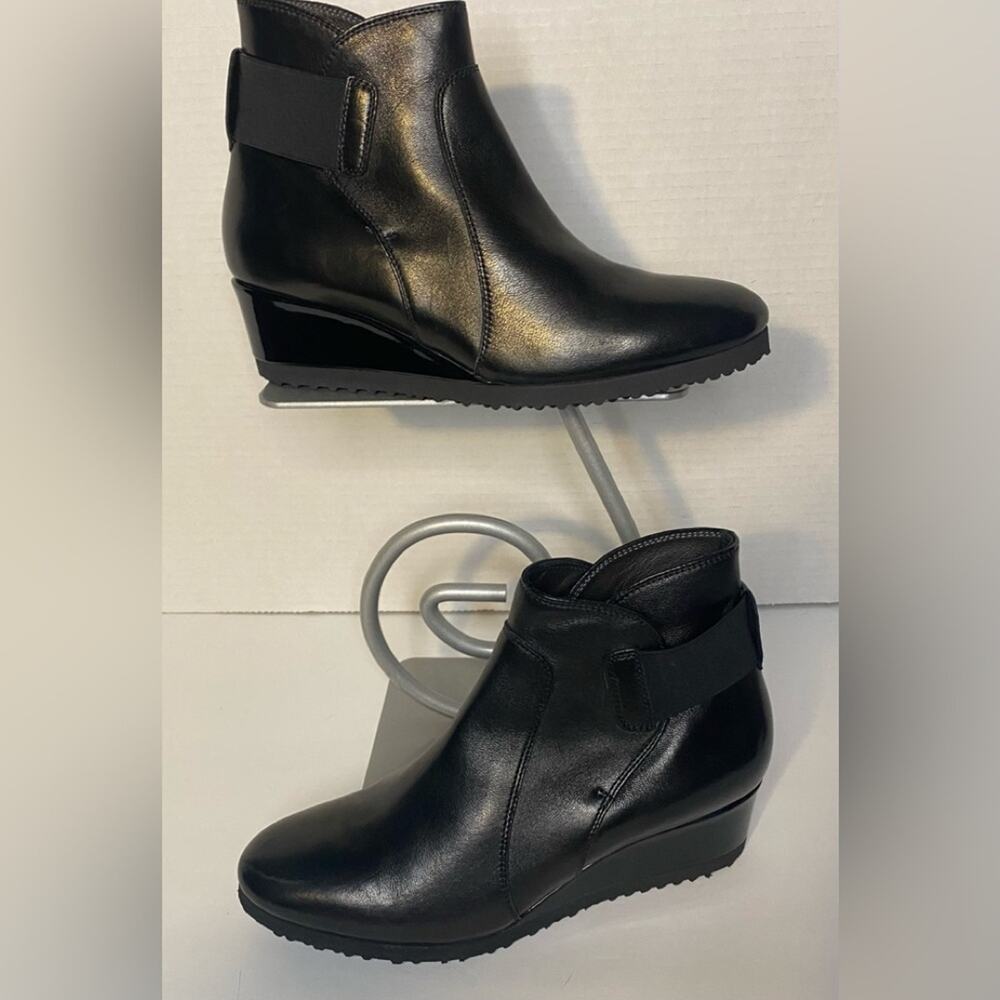 Italian black leather ankle boot with rubber sole and elastic around the back